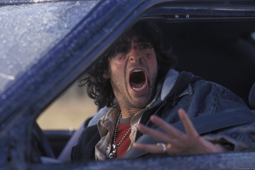 Rory panics inside his car during the highway disaster.