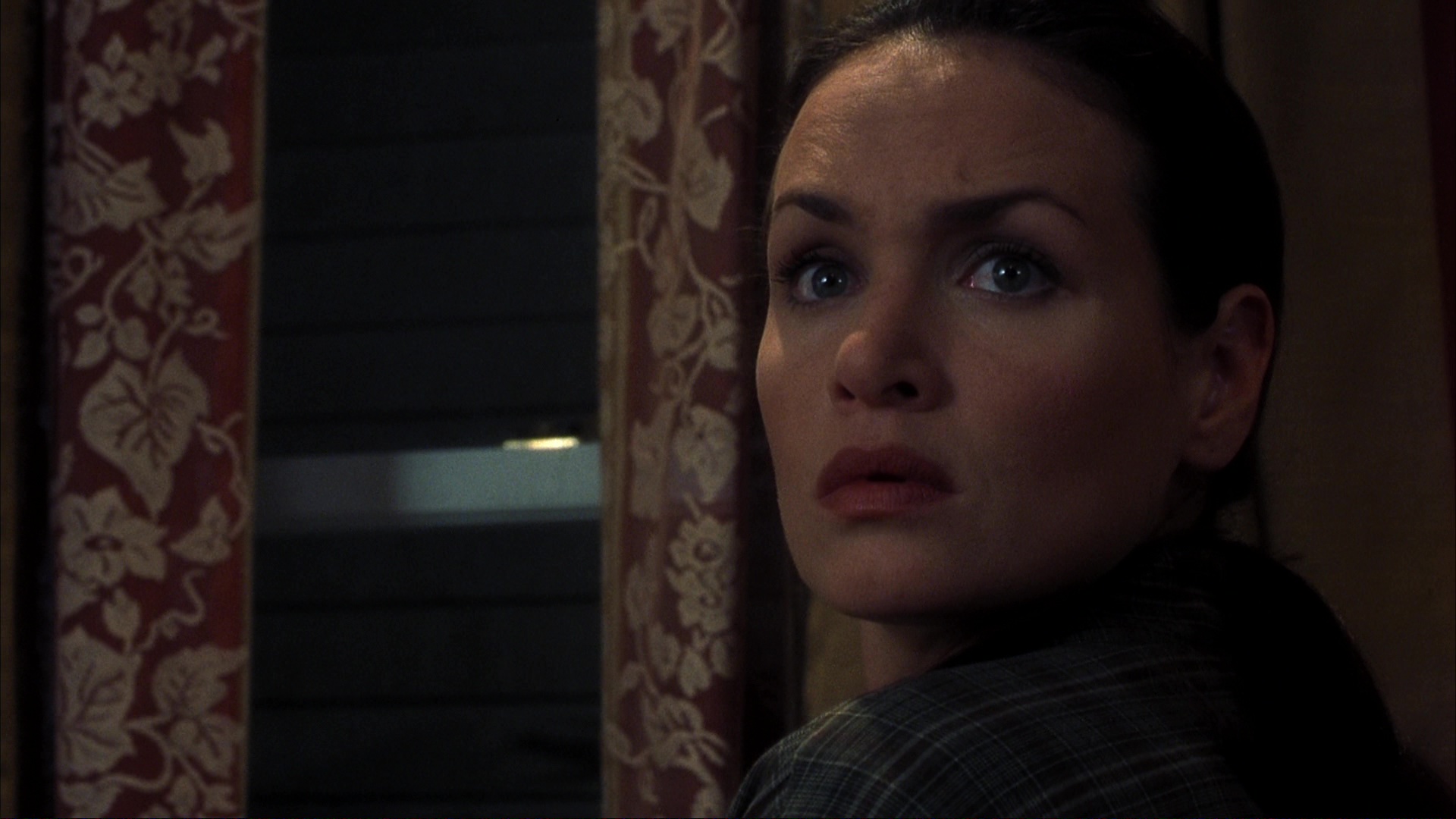 The fire at Ms. Lewton's house and the investigation. Film frame 00965.