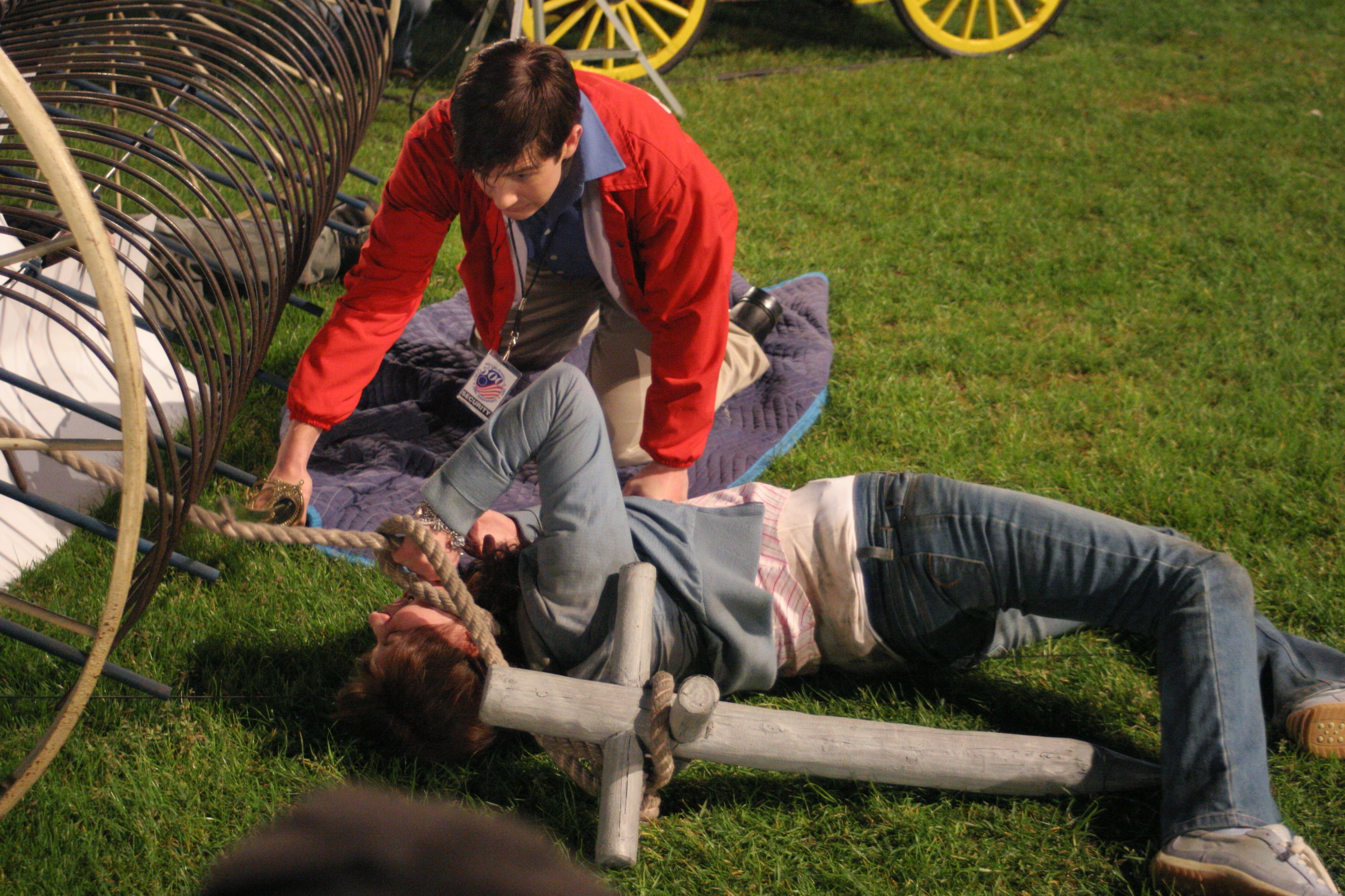 Kevin helps Julie on the fairground grass.