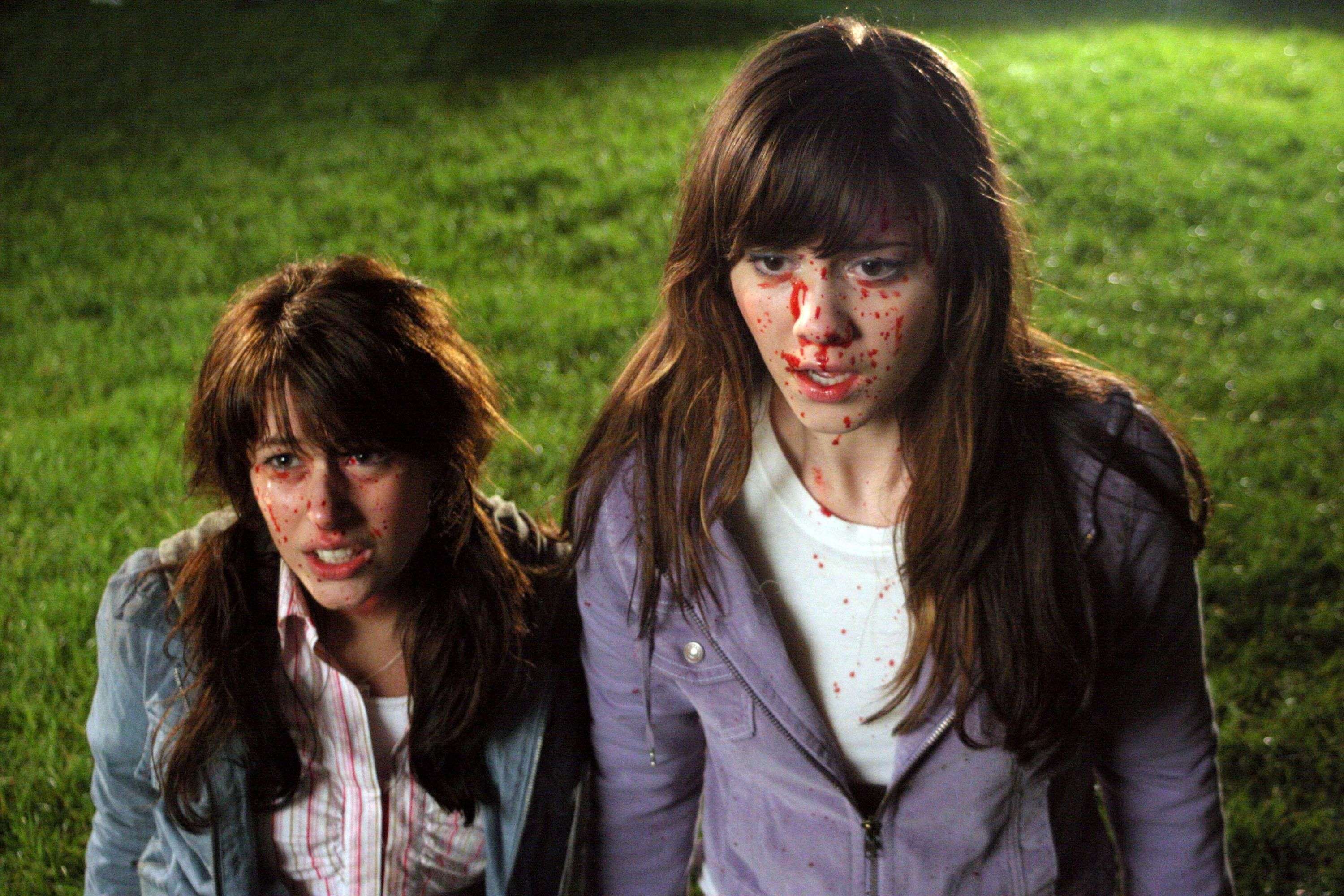 Final Destination 3 — Wendy and Julie crouch on the grass