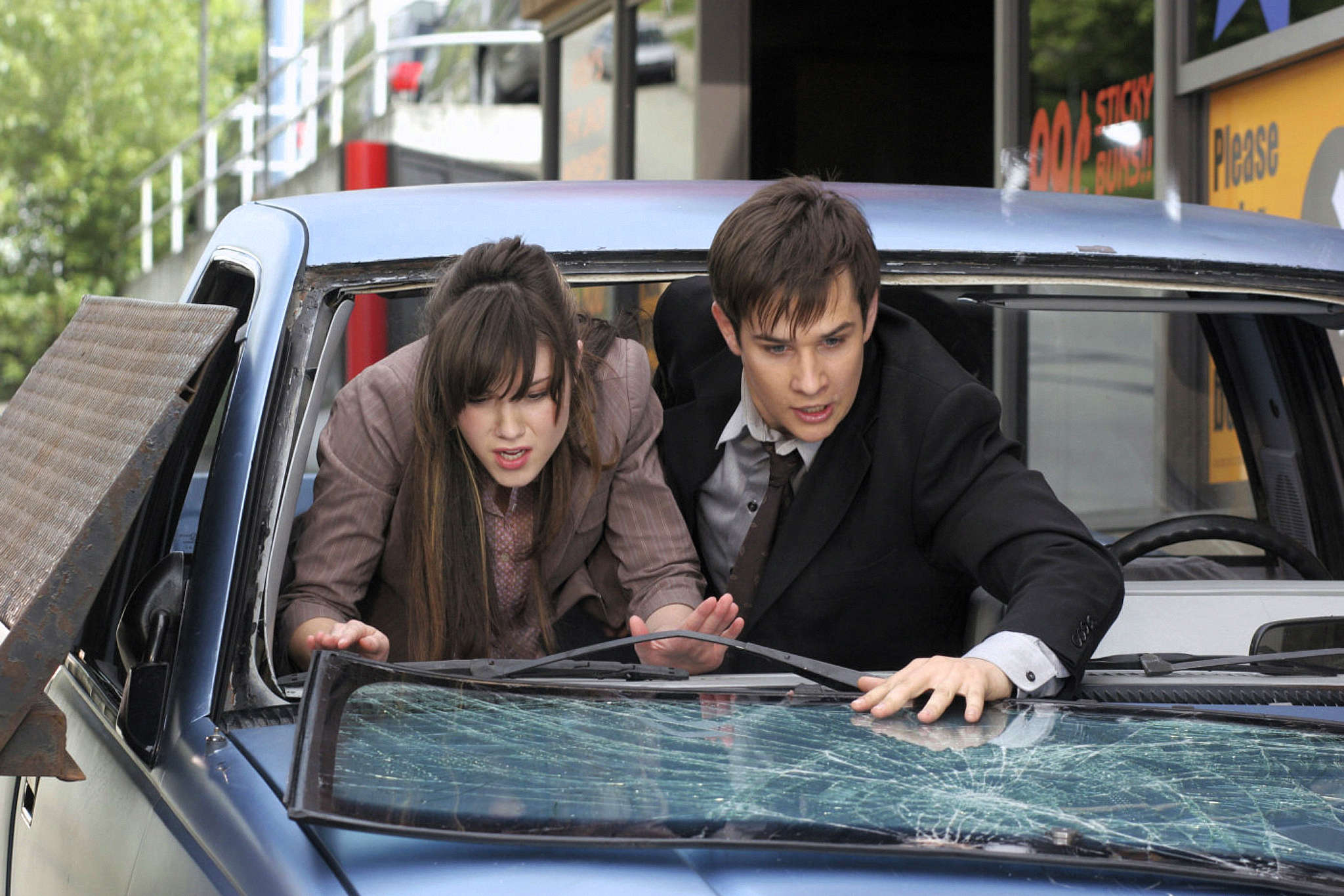 Final Destination 3 — Wendy and Kevin brace against the vehicle roof
