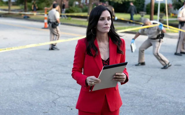 Gale behind the police tape.