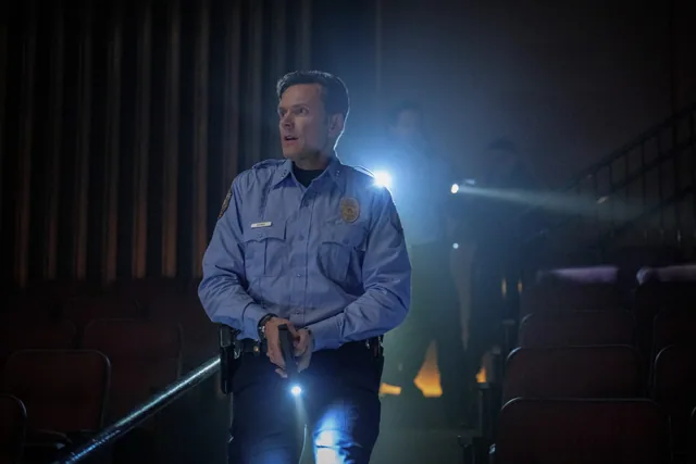 Mark searching with a flashlight.