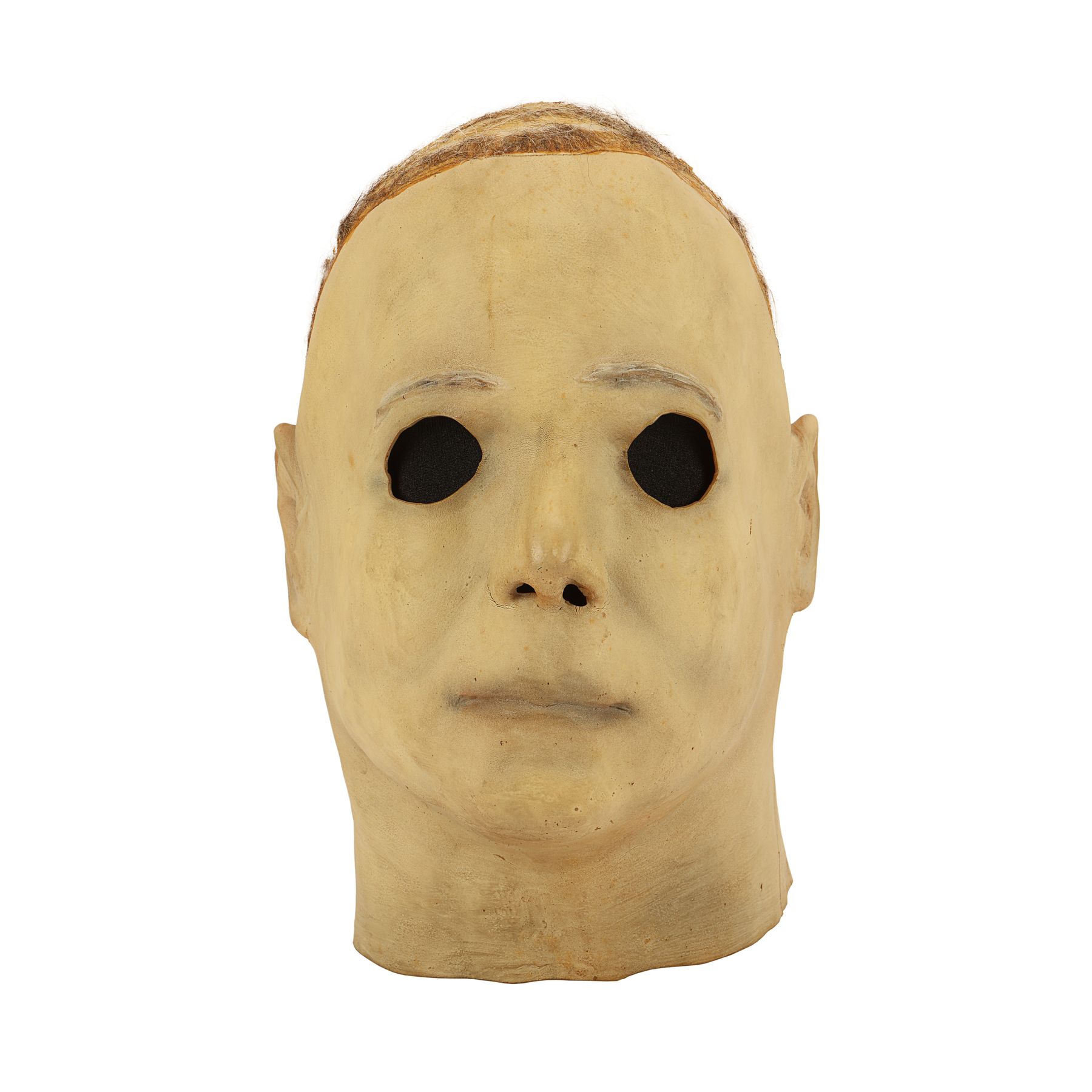 Production-made Michael Myers mask, front view. The surviving mask no longer has its hair. Later catalog photograph by Propstore.
