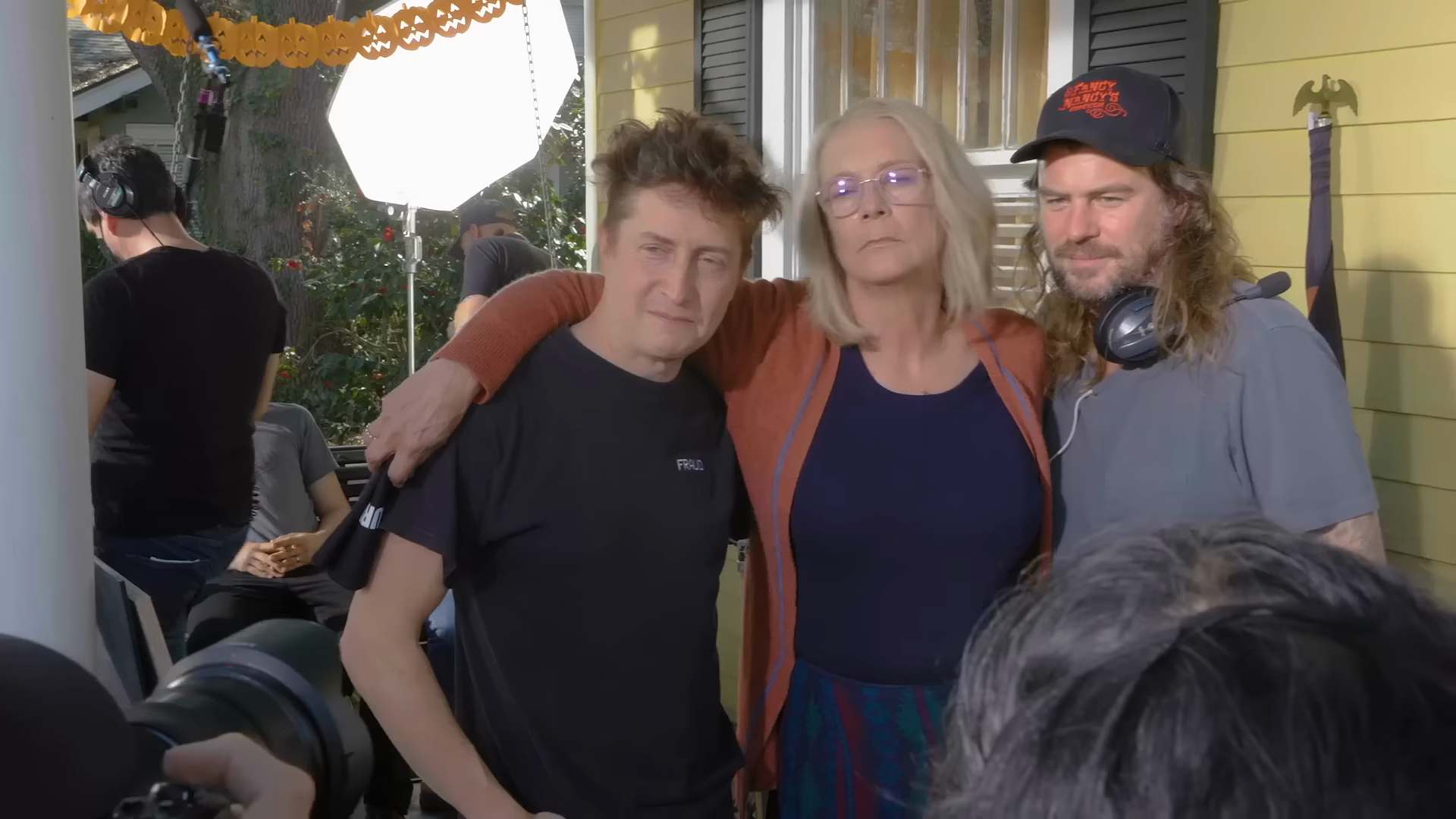 Jamie Lee Curtis poses with crew beside the camera and lighting equipment. Frame at 33 seconds from Universal’s official Halloween Ends — Jamie’s Journey featurette.