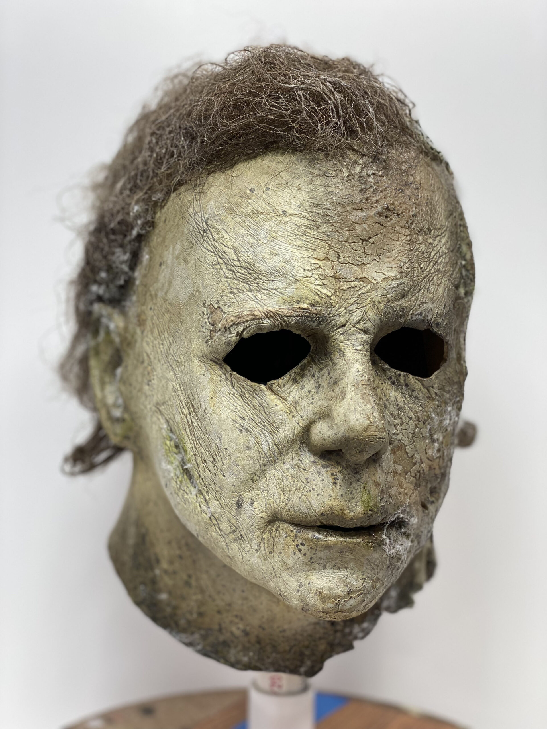 Three-quarter workshop view of the finished Halloween Ends mask, showing its cleaner side.