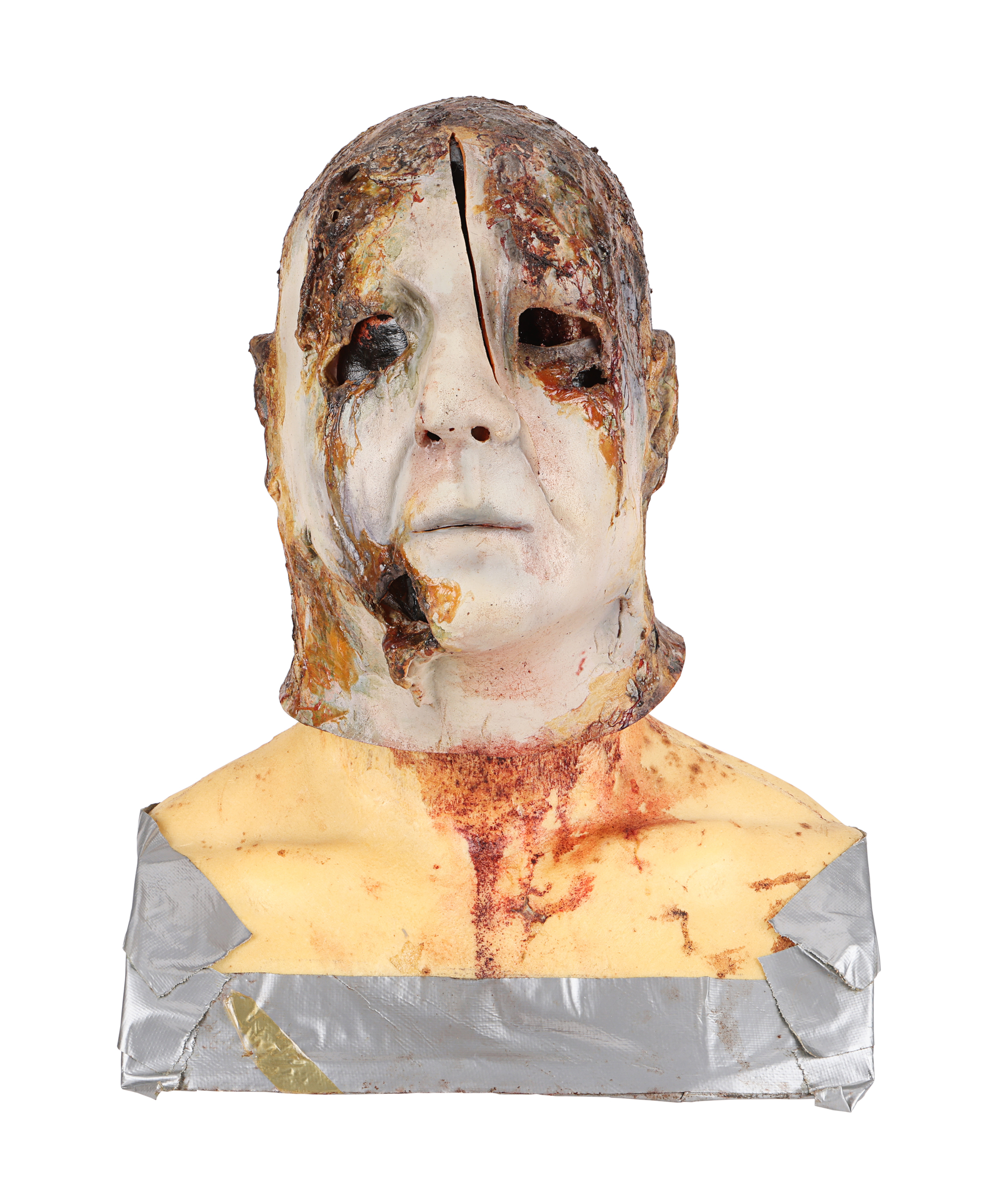 Burnt axe-attack mask created for an alternate ending, front view. Later catalog photograph by Propstore.