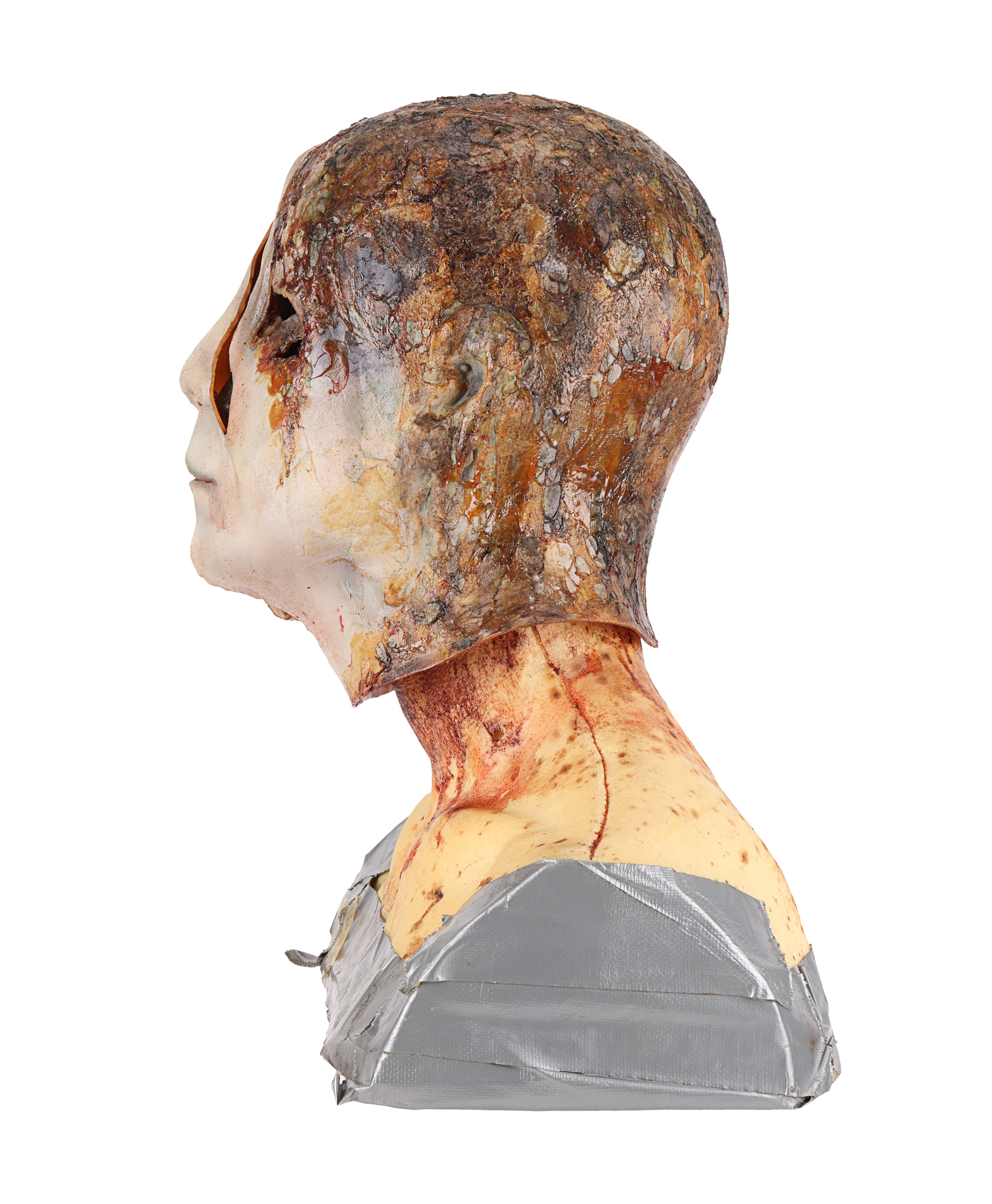 Burnt axe-attack mask created for an alternate ending, left-facing profile. Later catalog photograph by Propstore.