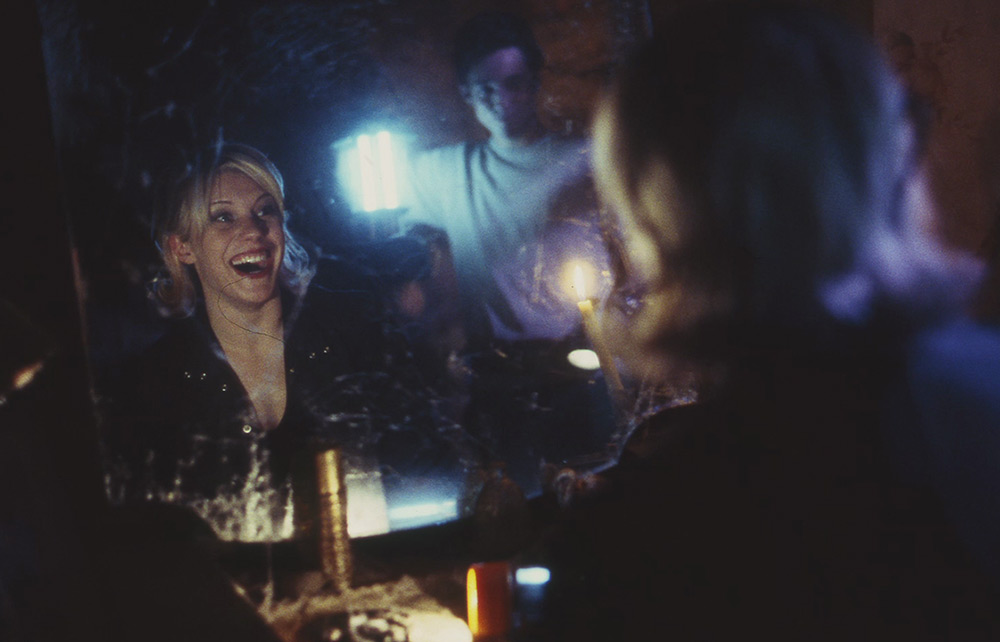 Jen looks into a mirror in a scene from Halloween: Resurrection.