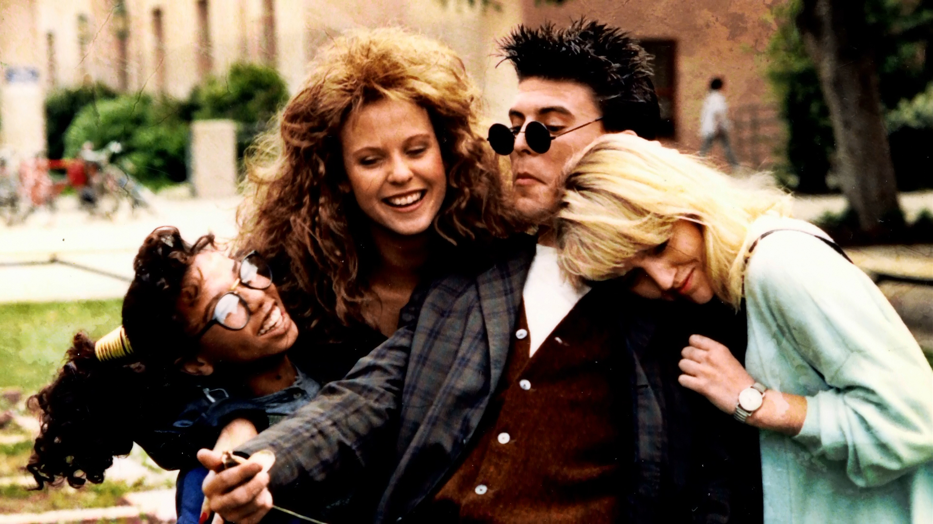 The young cast joking together outdoors between scenes.