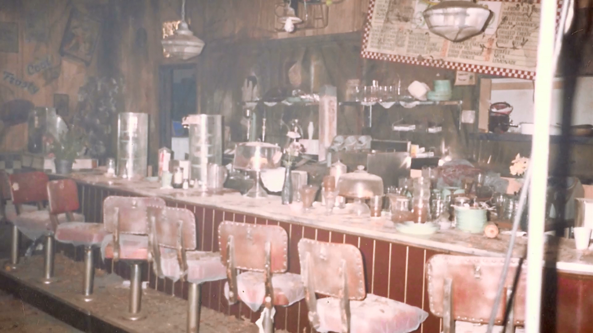 The Crave Inn interior set with counter, stools and dressing visible.