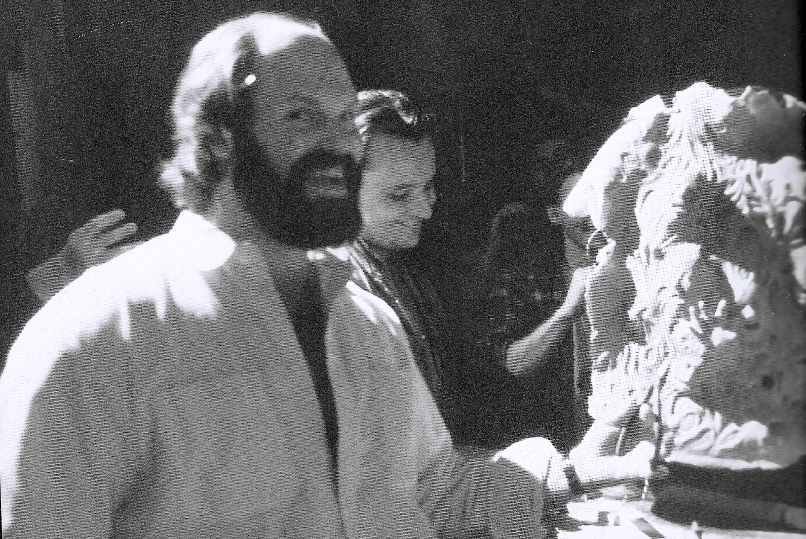 John Carl Buechler and an artist beside the sculpted torso of trapped souls.