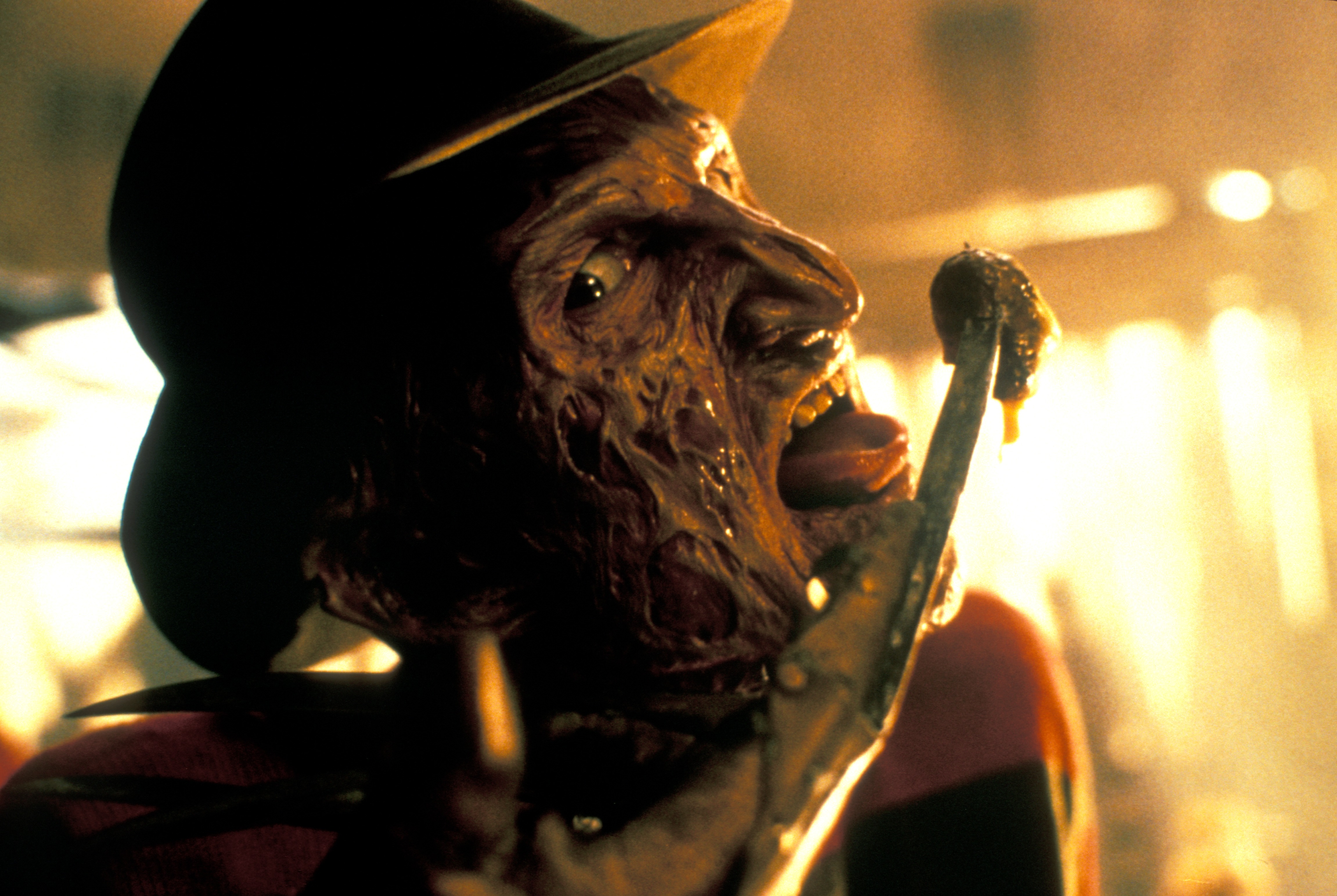 Freddy raises a gloved finger.