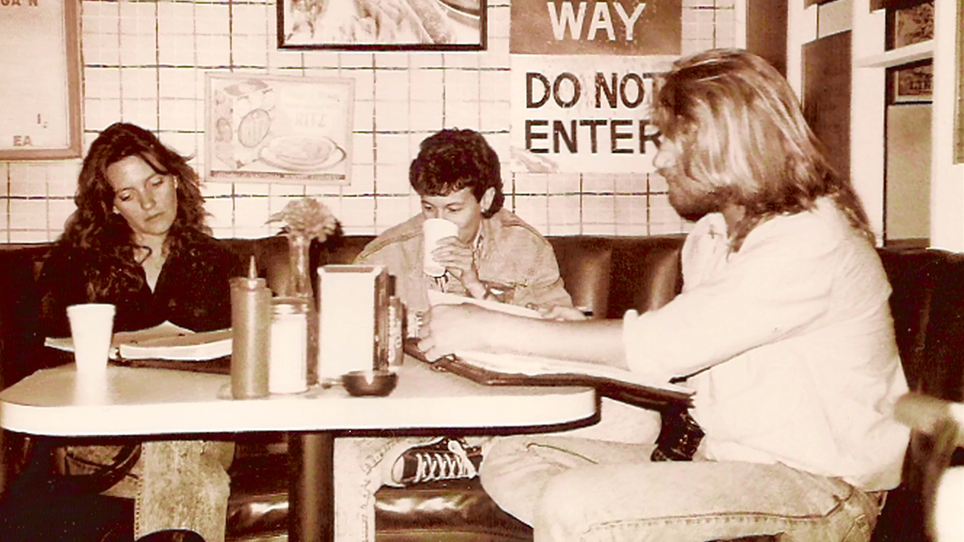 Alice and her friends at a Crave Inn table.