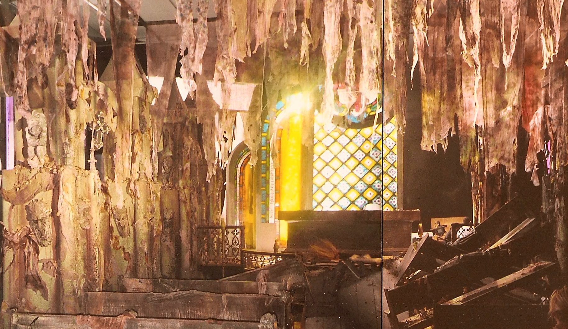 The Gothic interior set, showing stairs, hanging material and window lighting.