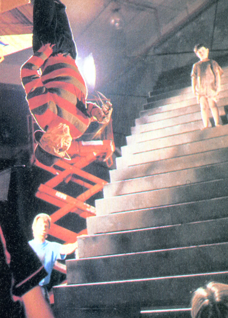 Wide production photograph of the upside-down Freddy staircase rig.