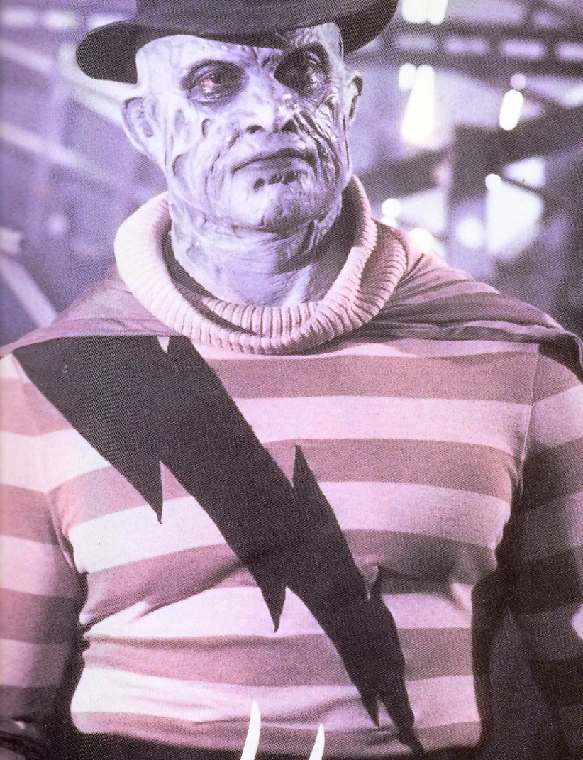 A front costume-reference view of Super Freddy's exaggerated chest and striped outfit.