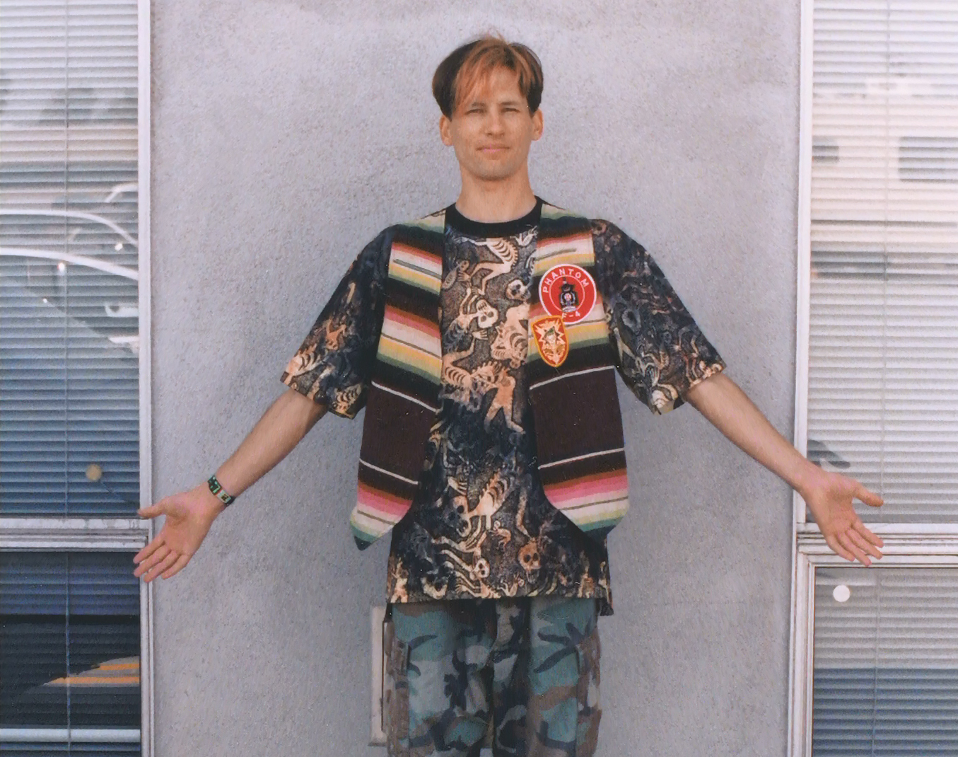 The comic-book victim's wardrobe reference pose, with arms held outward.