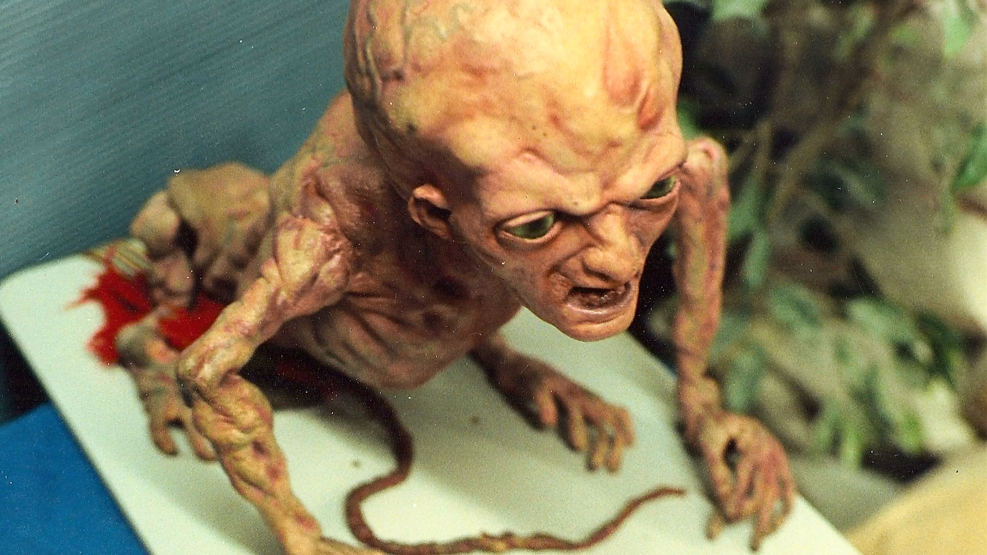 Overhead view of the Baby Freddy puppet and its exposed operating cables.