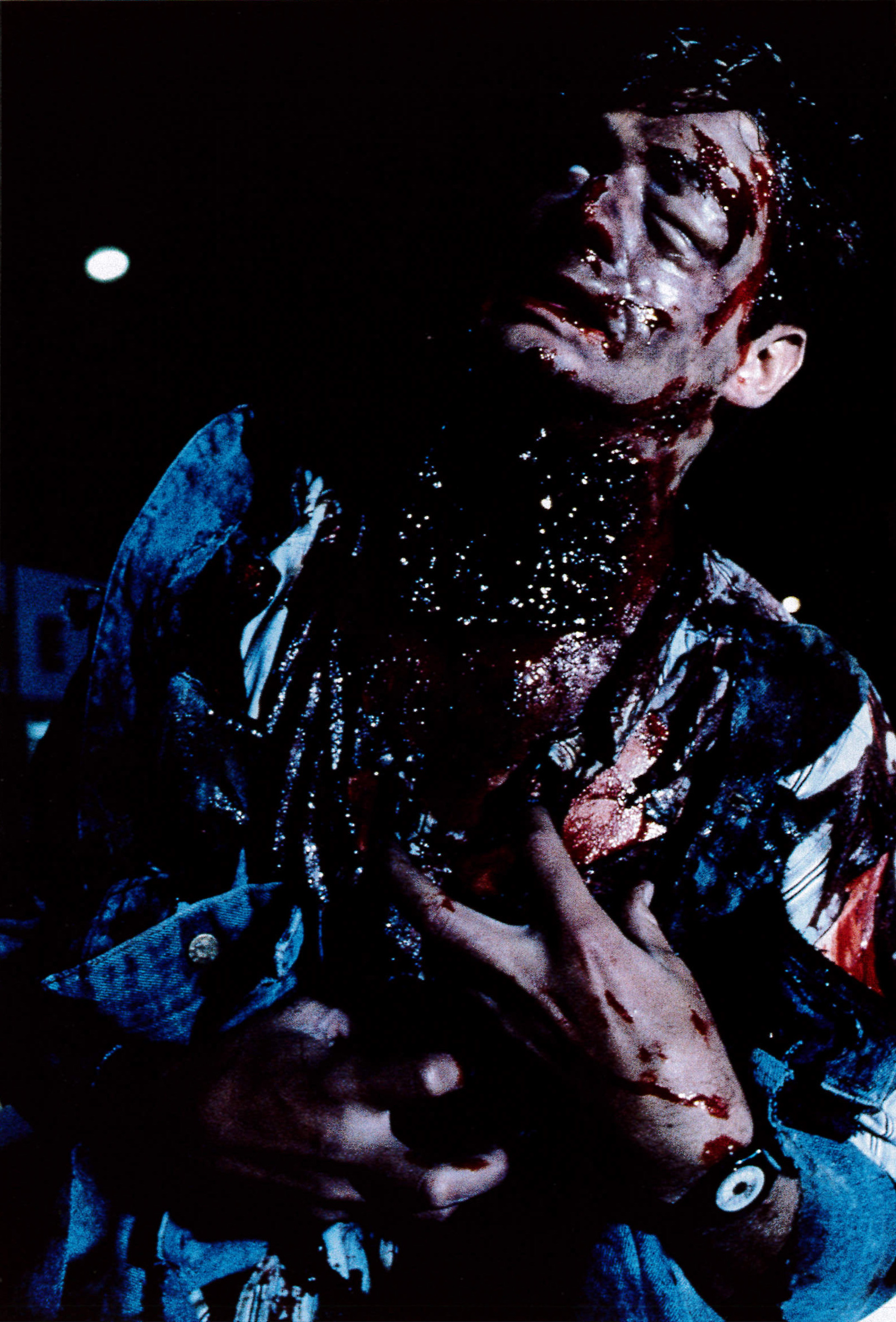 Danny Hassel holding part of the transformation appliance during a practical-effects setup.