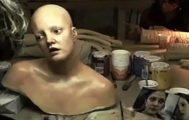 A face-and-shoulder effects bust on the workshop table.