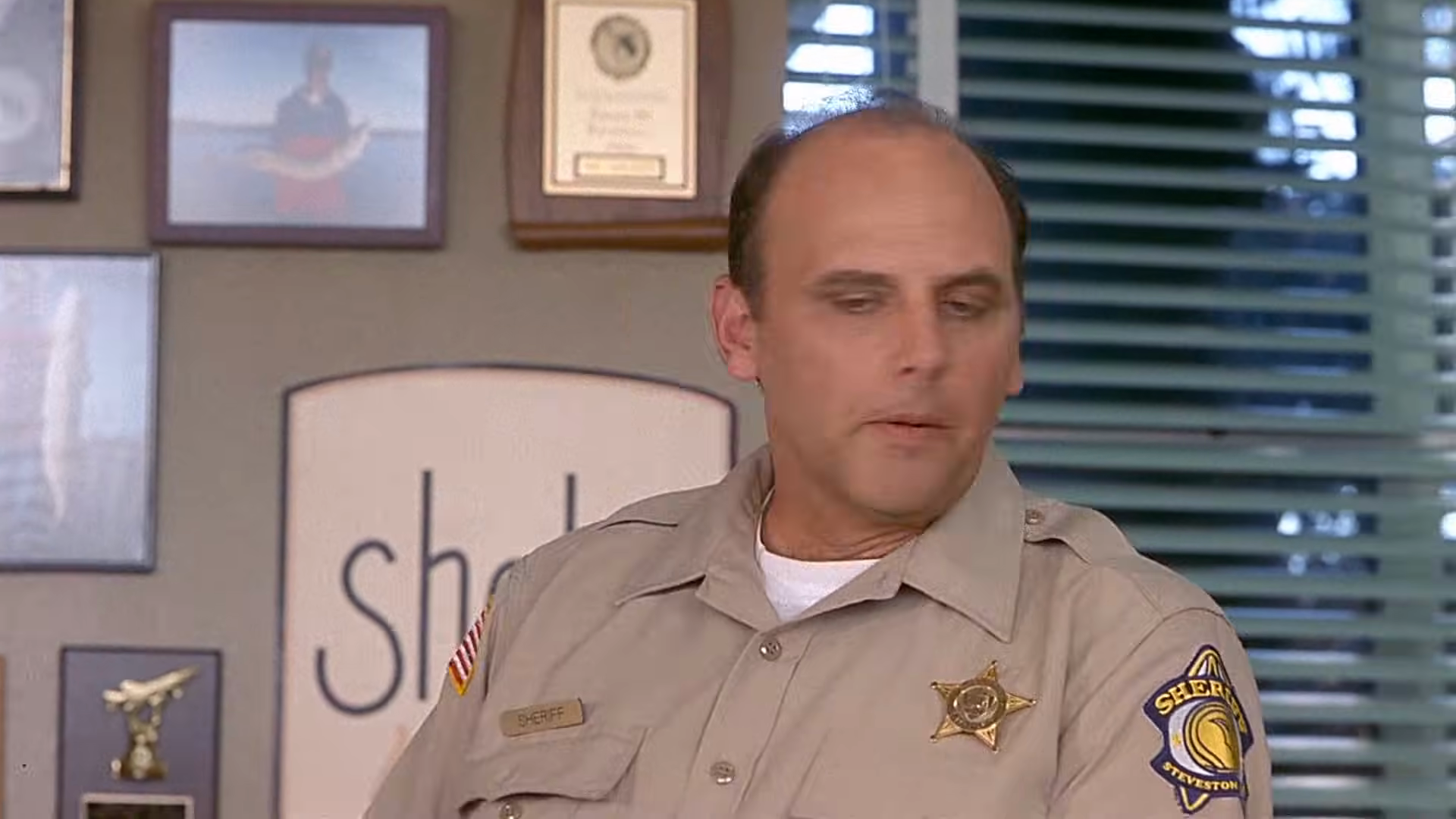 Police questioning in the principal’s office. Clip frame 00:48.