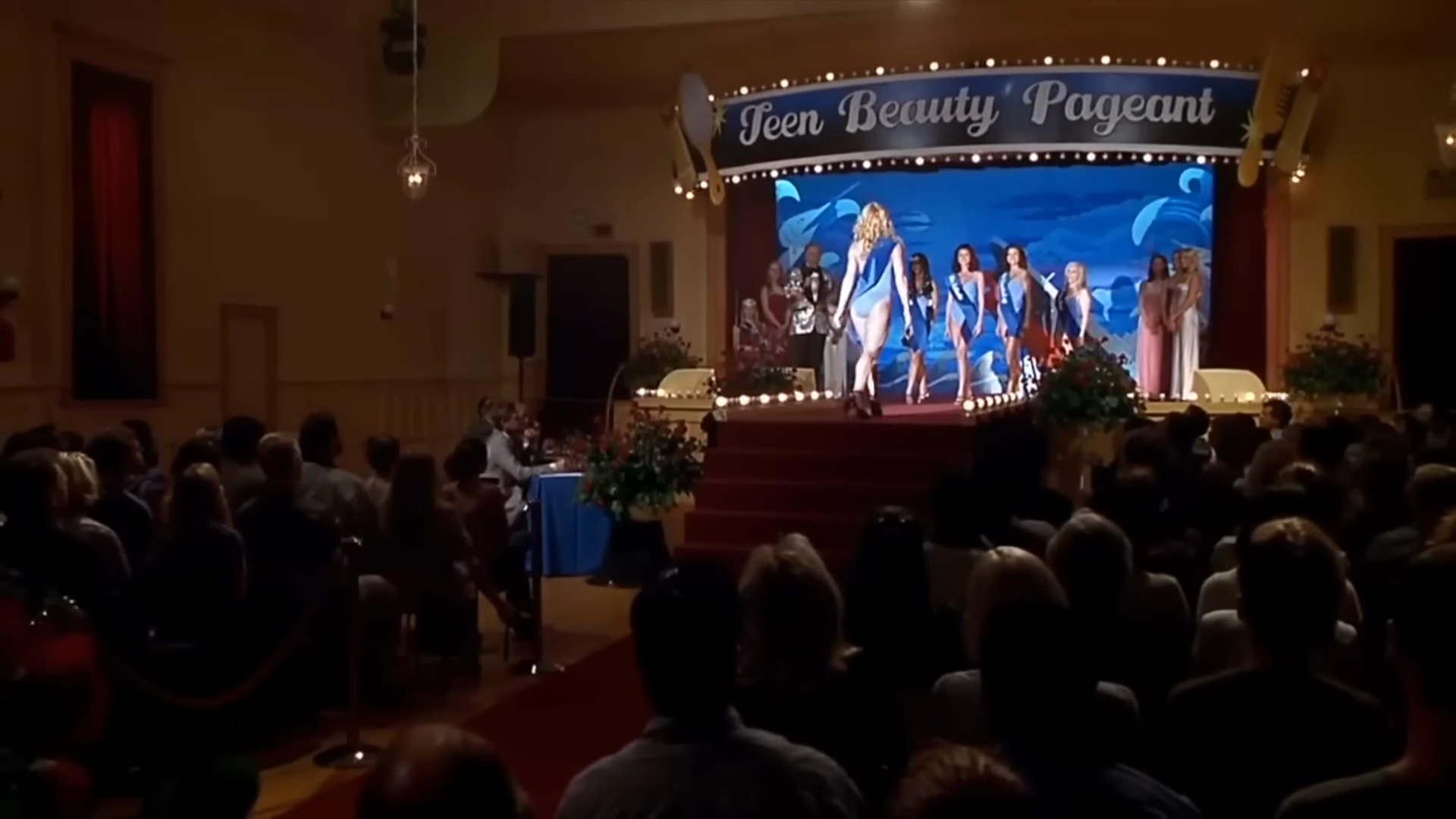 The beauty pageant. Clip frame 00:16.