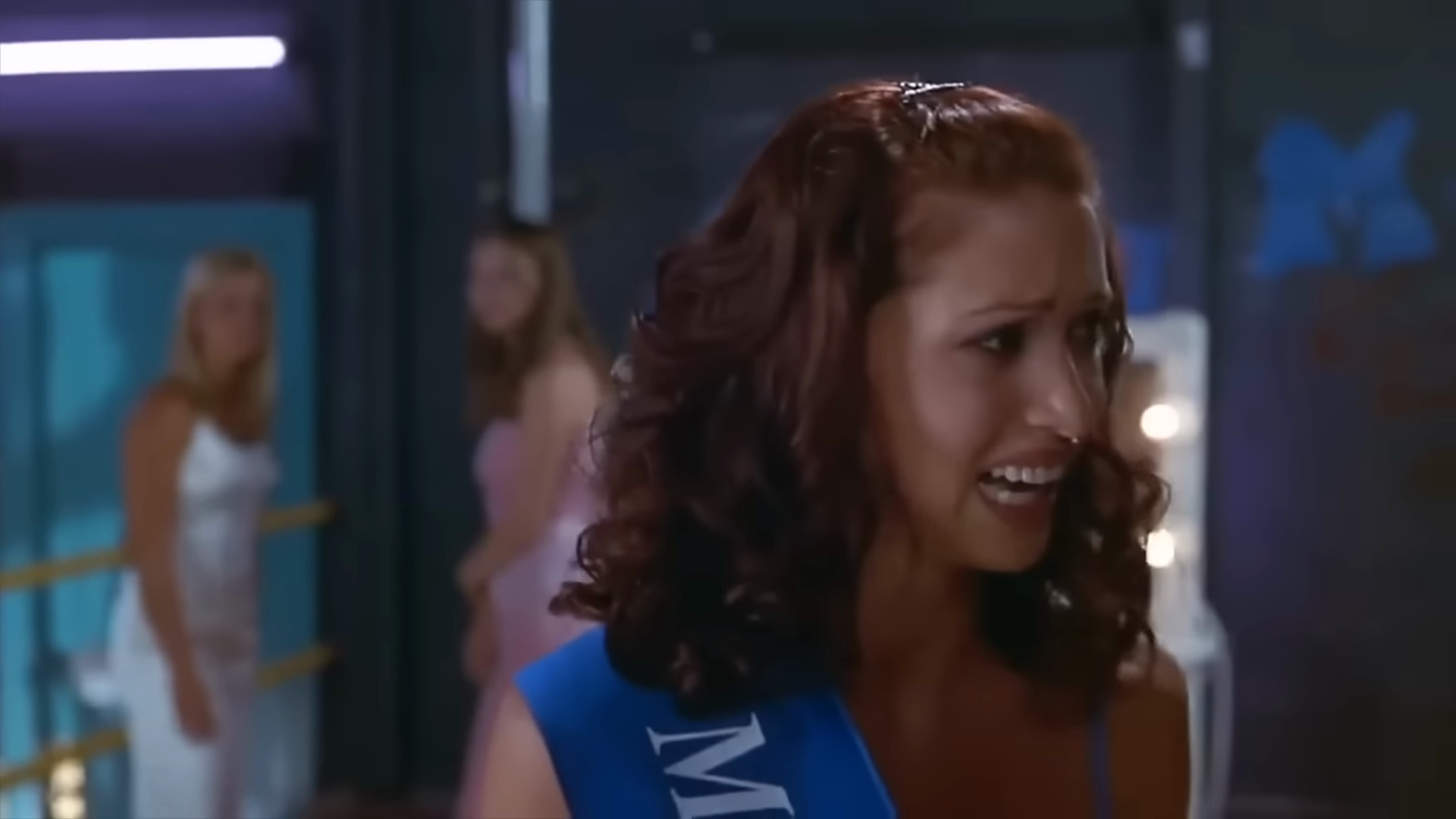 The beauty pageant. Clip frame 02:24.