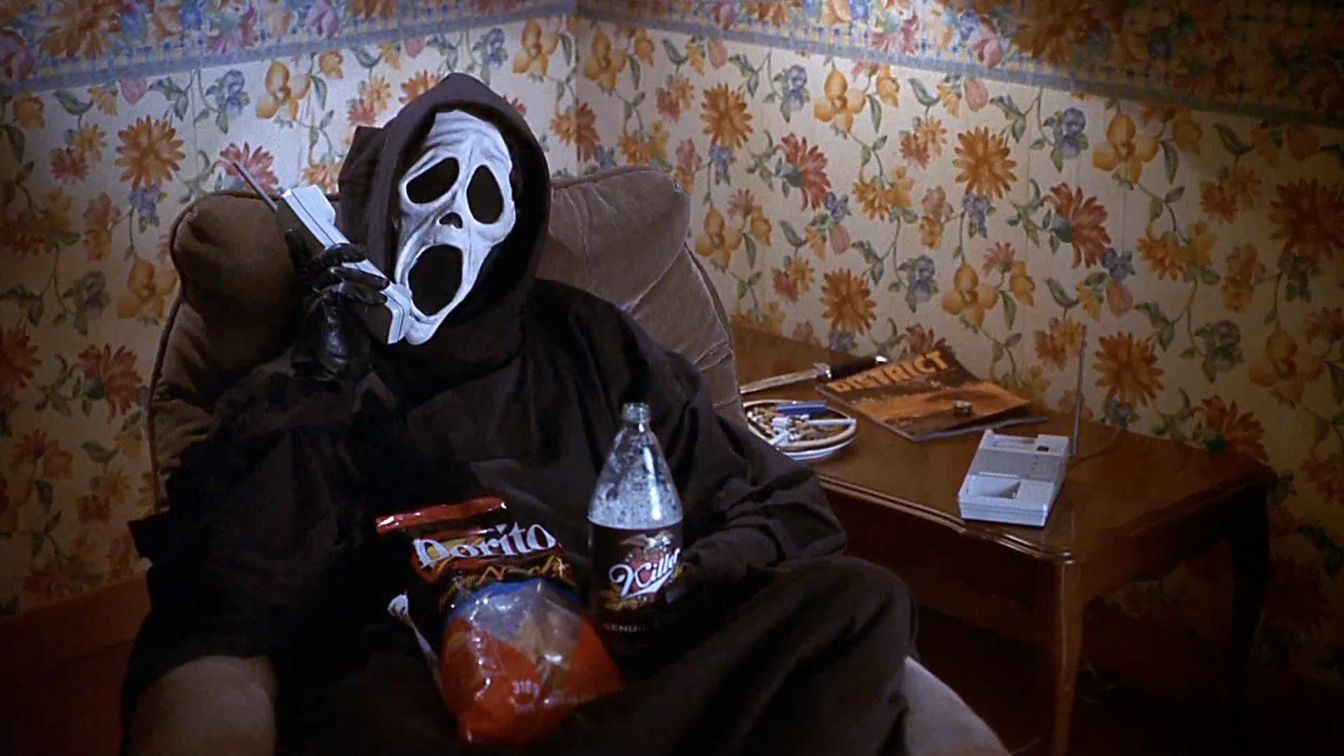 The masked killer joins the phone call. Clip frame 00:32.