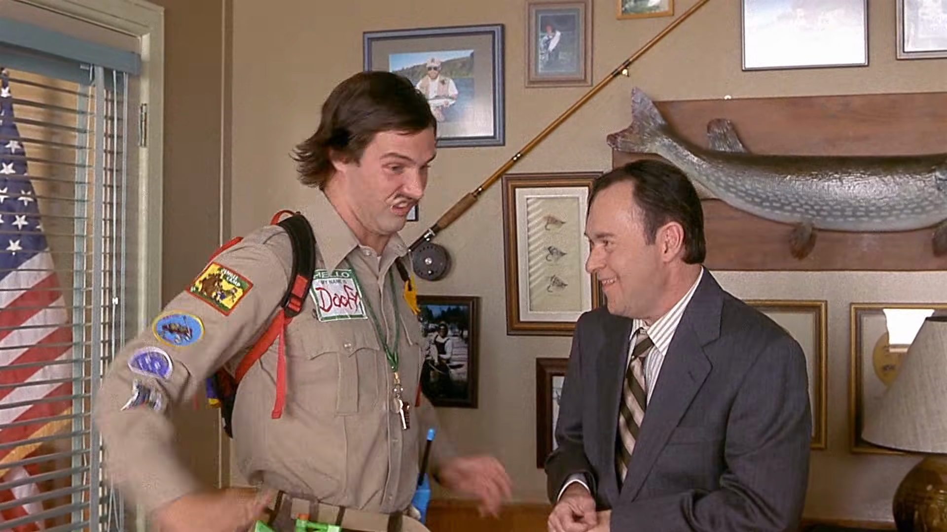 Police questioning in the principal’s office. Clip frame 00:56.