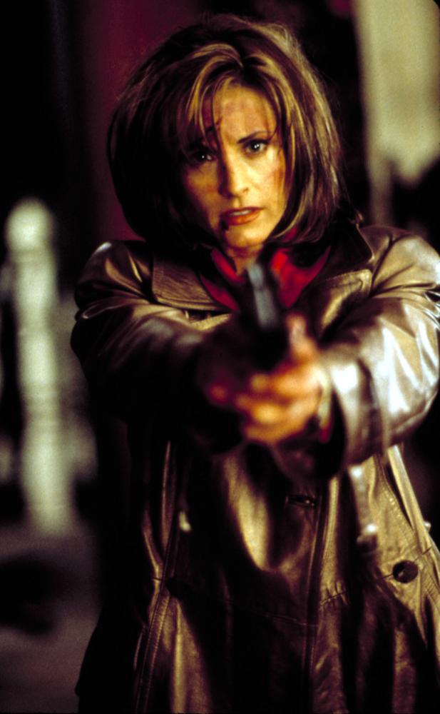 Gale aims her gun.