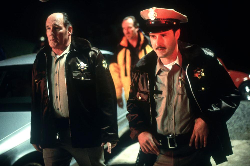 Dewey and the officers at night.