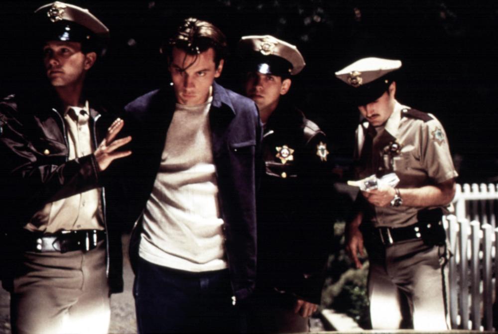 Officers take Billy away.