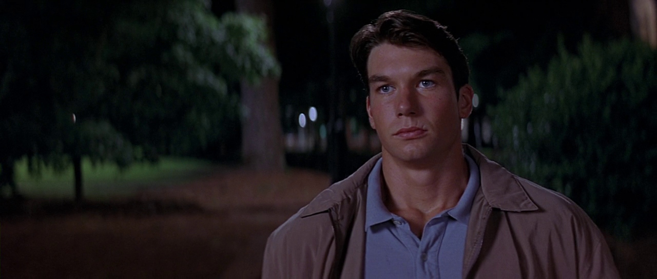 Derek outside at night. Film frame.