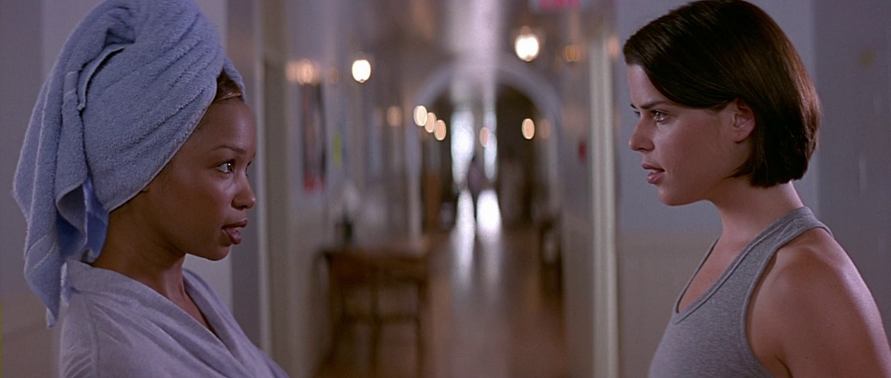 Hallie and Sidney in the dormitory hallway. Film frame.