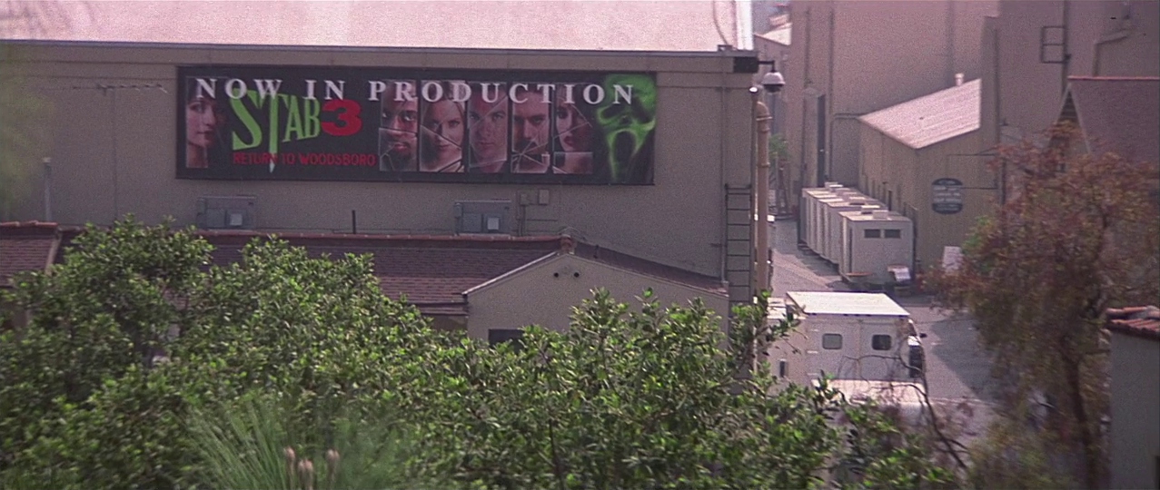 Stab 3 production banner on the fictional studio lot. Film frame.