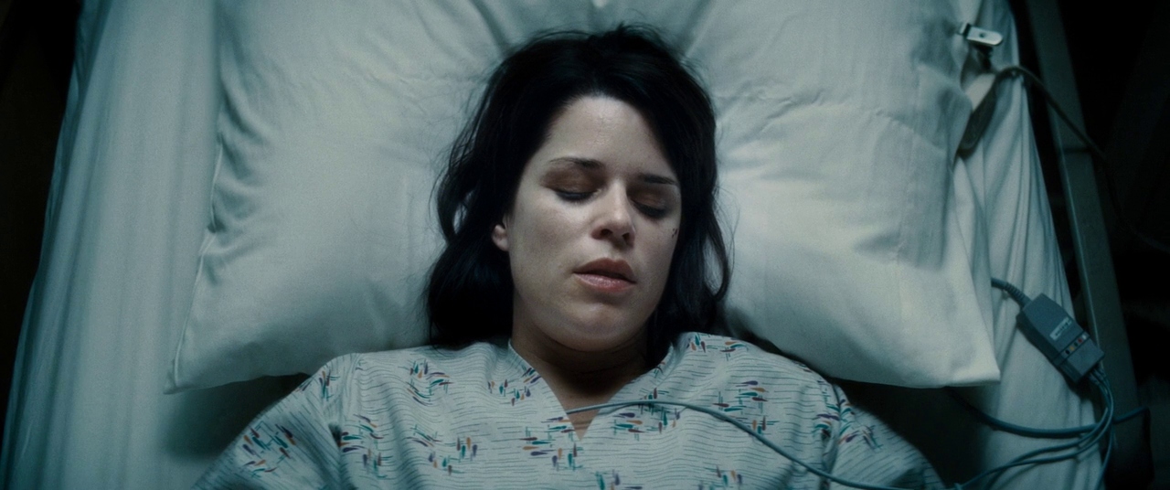 Sidney in a hospital bed. Film frame.