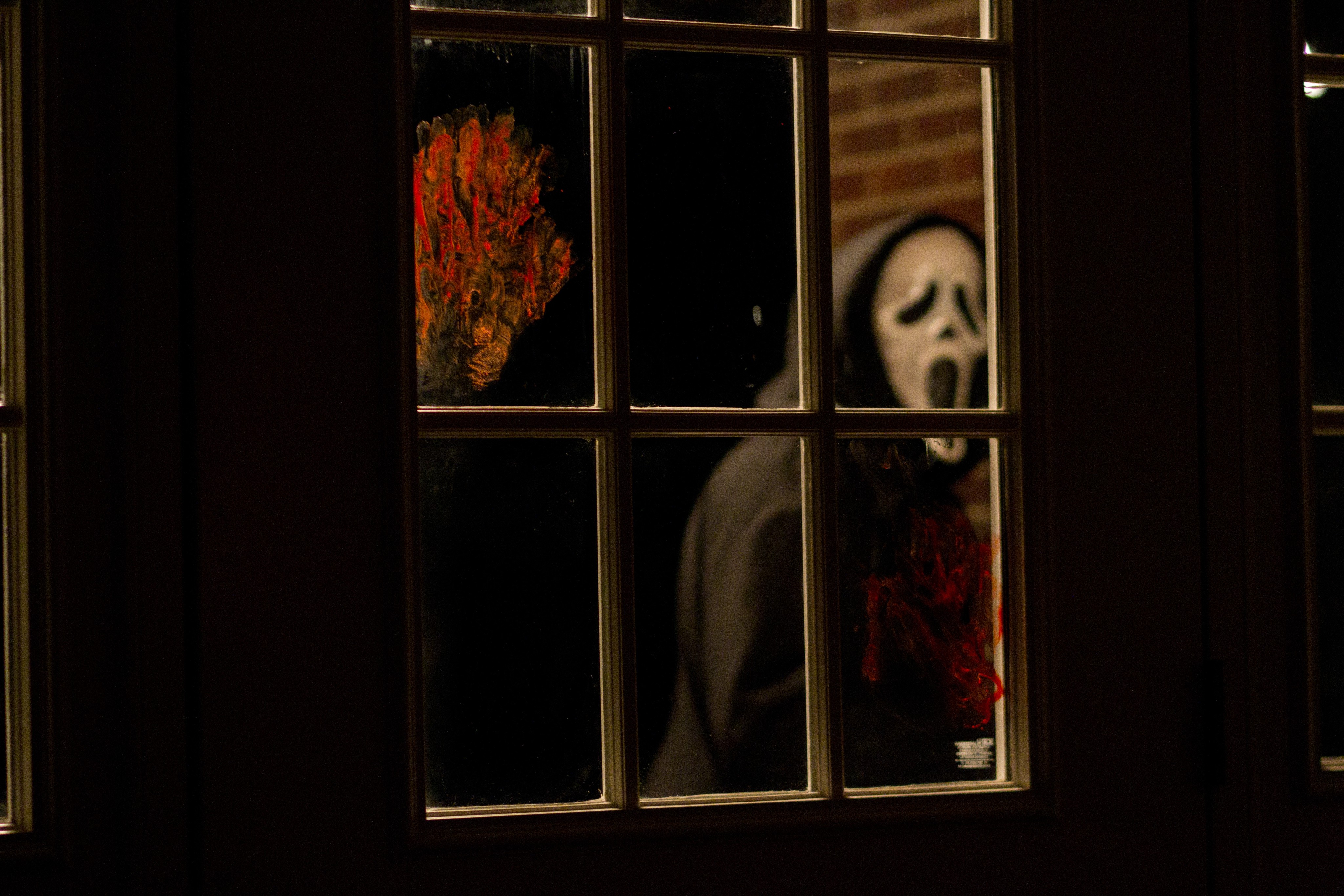 Ghostface outside the window.